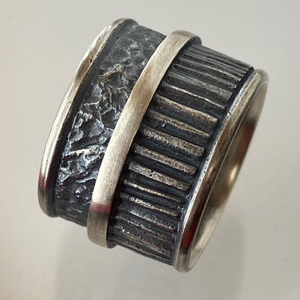wide Sterling Silver Band with strong patterns