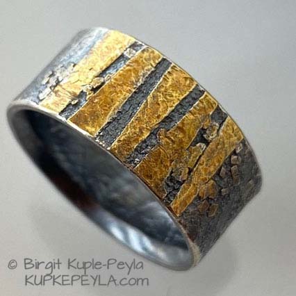 lace and stripe patterns intermixed on a ring