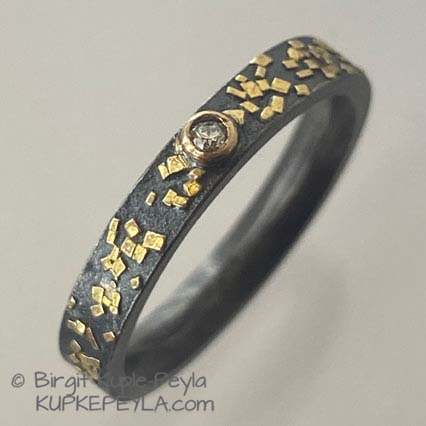 slim confetti style ring with diamond